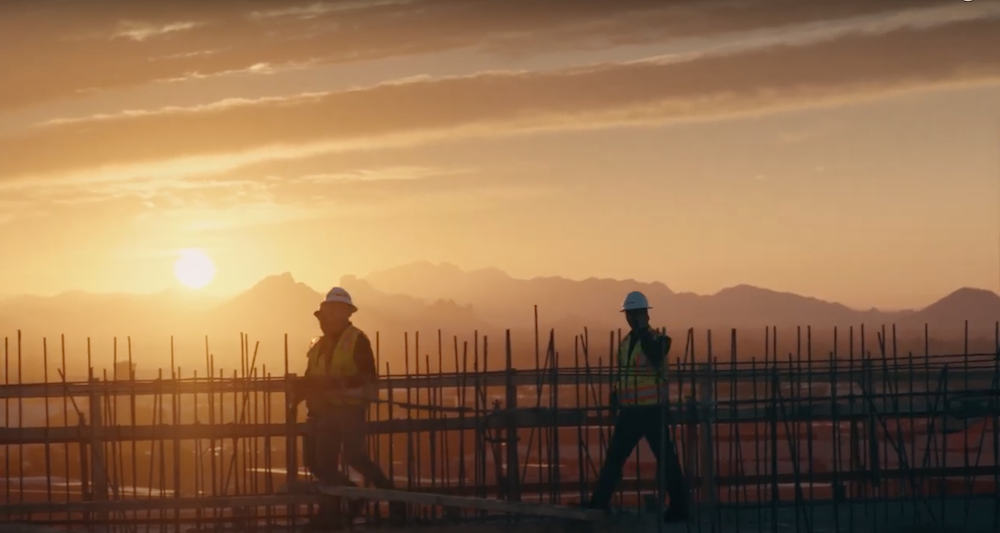 Construction crew on site at dawn