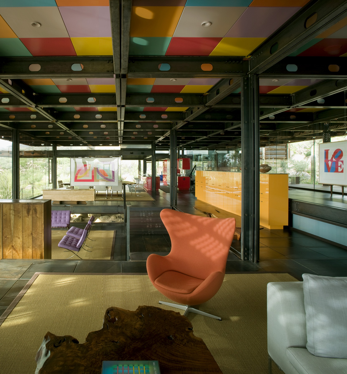 The open floor design of Relic Rock is presented with colorful furniture, ceilings and rugs.