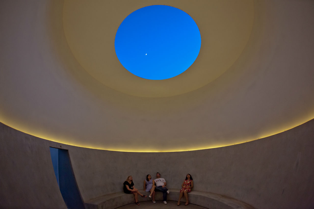 A rich blue fills the center of the Knight Rise skyscape on a Scottsdale evening