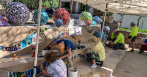 Annette Coleman installing Pinball Wizard, Courtesy of Scottsdale Public Art