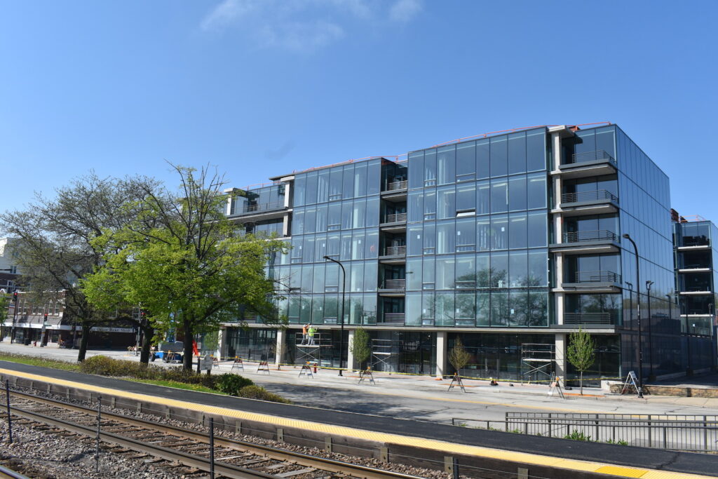 Inside 6story Optima Verdana apartment complex, which is close to